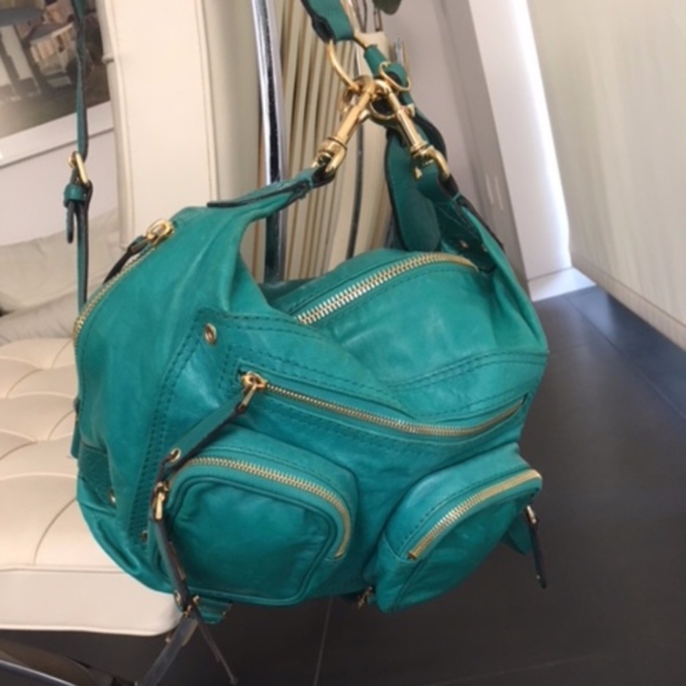 AUTHENTIC Green leather 'Darwin Convertible Backpack' with gold hardware.